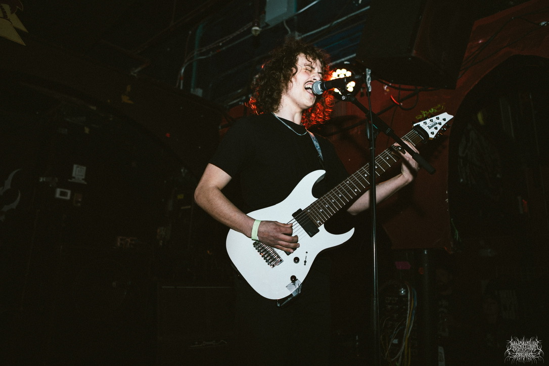 a portrait of griffin singing